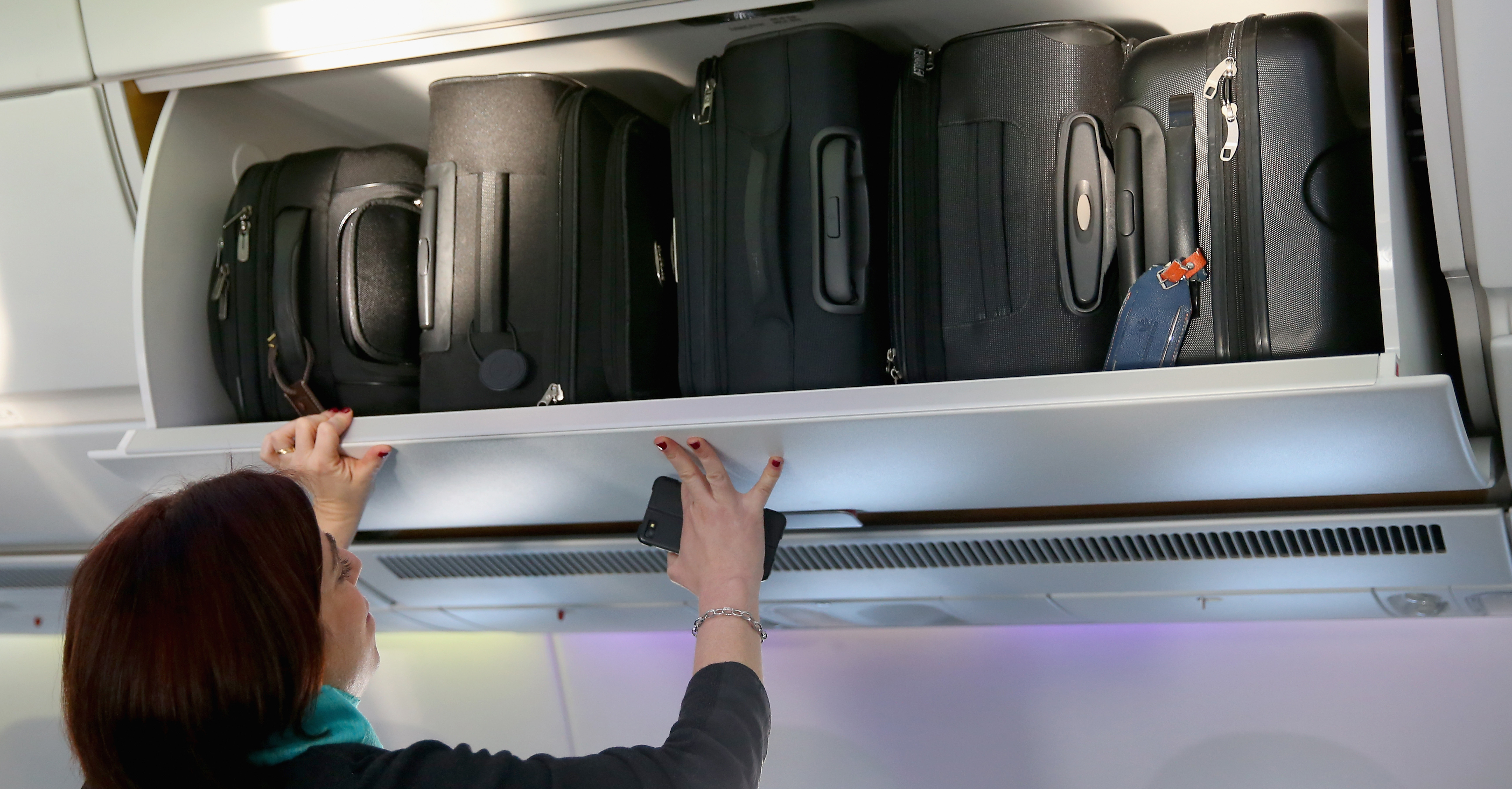MUNICH, GERMANY - FEBRUARY 27:  The hand baggage overhead bins in the cabin of a new Airbus A350X WB passenger plane on the tarmac at Munich Airport during a presentation of the new plane by Airbus officials on February 27, 2015 in Munich, Germany. The A350 is a long-distance passenger plane that Airbus has developed to compete against the Boeing 787 Dreamliner.  (Photo by Alexander Hassenstein/Getty Images)
