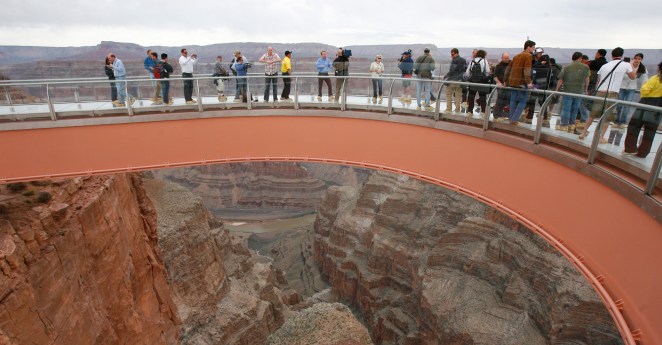 People walk on the Skywalk during the First Walk event at the Grand Canyon on the Hualapai Indian Reservation at Grand Canyon West, Ariz., Tuesday, March 20, 2007. The Skywalk opens to the general public on March 28. (AP Photo/Ross D. Franklin)