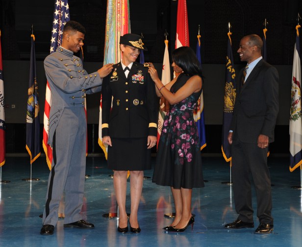 Army Surgeon General Lt. Gen. Nadja Y. West has her three-star shoulder boards pinned on by son, Logan, and daughter, Sydney while her husband Don looks on, Feb. 9, 2016. (U.S. Army photo/J.D. Leipold)
