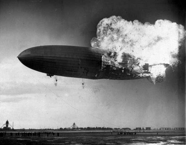 The German zeppelin Hindenburg bursts into flames as it noses toward the mooring post at the Naval Air Station in Lakehurst, N.J. on May 6, 1937. (AP Photo/Murray Becker)