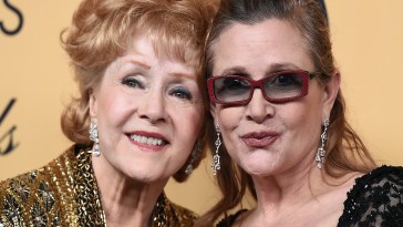 Debbie Reynolds, winner of the Screen Actors Guild lifetime award, left, and Carrie Fisher pose in the press room at the 21st annual Screen Actors Guild Awards at the Shrine Auditorium on Sunday, Jan. 25, 2015, in Los Angeles. (Photo by Jordan Strauss/Invision/AP)