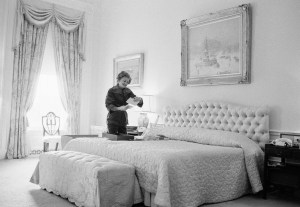 First lady Betty Ford pauses during her packing to look over mementos in the Ford bedroom at the White House, Jan. 19, 1977, Washington, D.C. (AP Photo)