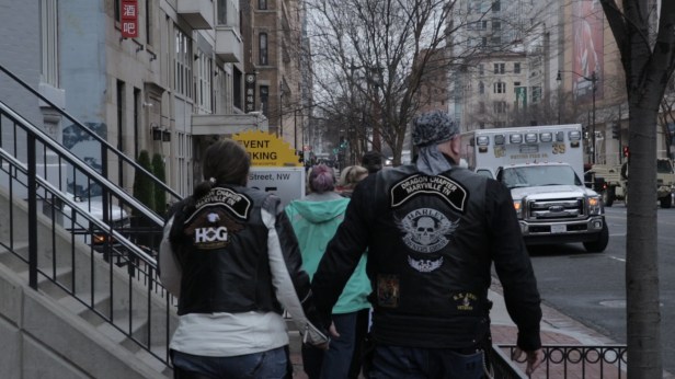 Bikers for Trump walk hand-and-hand into the protests