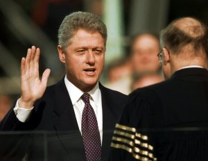 President Clinton is sworn in for his second term by Supreme Court Chief Justice William Rehnquist during the 53rd Presidential Inauguration Monday, Jan. 20, 1997, in Washington. (AP Photo/J. Scott Applewhite)