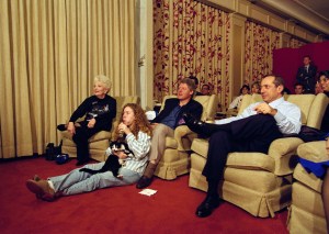 President Bill Clinton, flanked by Governors Ann Richards of Texas and Mario Cuomo of New York, watches the Dallas Cowboys and Buffalo Bills play in the Super Bowl with his daughter Chelsea and their cat, Socks, in the White House, Jan. 31, 1993, in the family theater. (AP Photo/Wilfredo Lee)