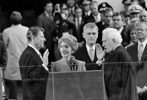 Chief Justice Warren Burger administers the oath of office to Ronald Reagan at the Capitol, Jan. 20, 1981. From left to right: Reagan, his wife Nancy, Sen. Mark Hatfield (R-Ore.), and at extreme right, outgoing President Jimmy Carter, with his wife Rosalynn behind him. (AP Photo/Bob Daugherty)