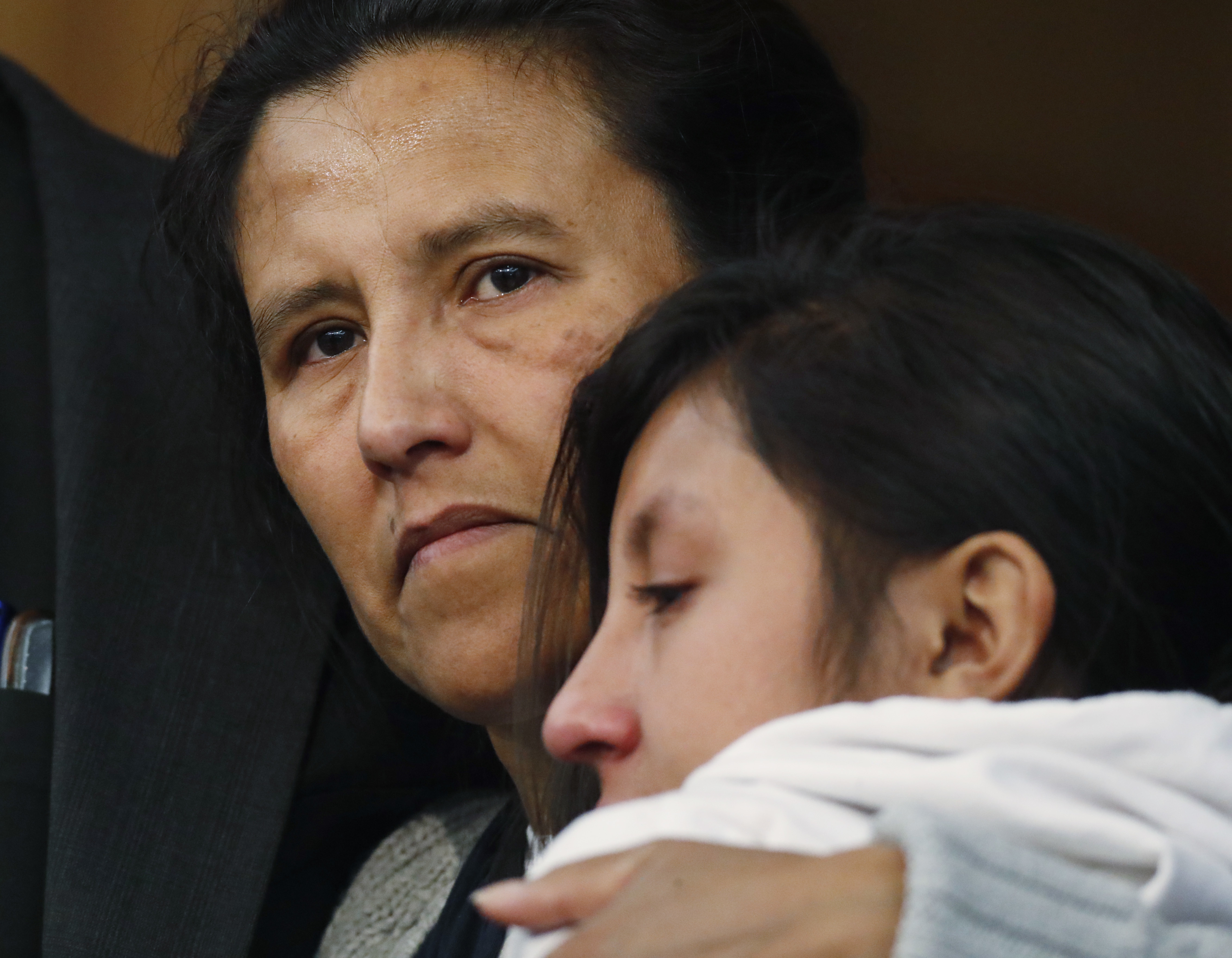 Jeanette Vizguerra, a Mexican woman seeking to avoid deportation from the United States, hugs her 12-year-old daughter, Luna, during a news conference in a church in which the she and her children have taken refuge Wednesday, Feb. 15, 2017, in Denver. U.S. immigration authorities have denied her request to remain in the country. (AP Photo/David Zalubowski)