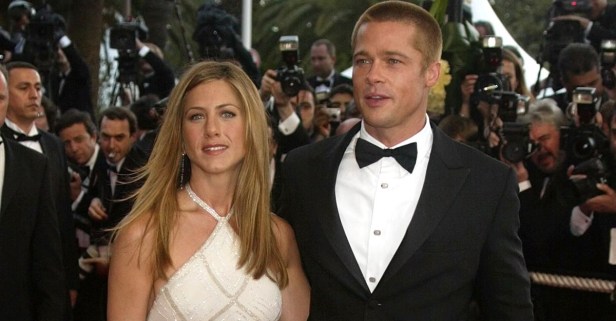 Brad Pitt, left, and his wife Jennifer Aniston arrive for the screening of the film "Troy," directed by German director Wolfang Petersen, at the 57th Film Festival in Cannes, France, Thursday, May 13, 2004. (AP Photo/Lionel Cironneau)