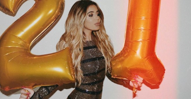 Brielle Biermann holding balloons