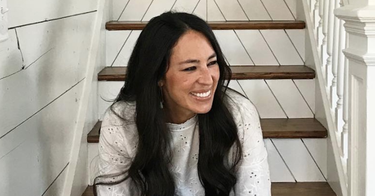 Joanna Gaines sitting on stairs