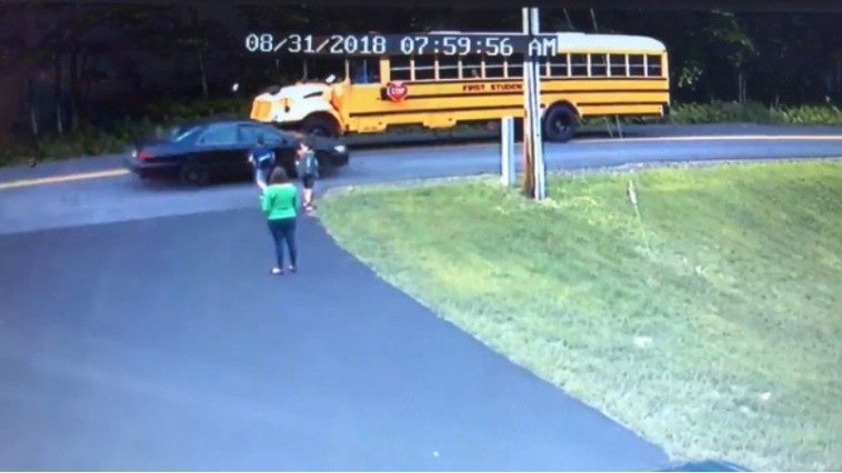 Shocking Video Shows Boy Nearly Hit By Speeding Car At School Bus Stop