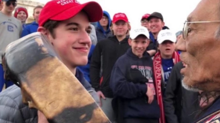 Students in 'MAGA' Hats Mock Native American After Rally