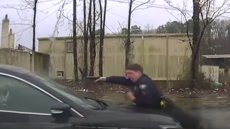 Officer Fires into Windshield