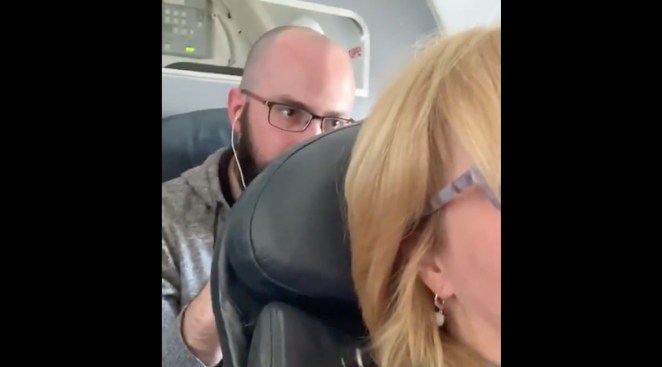 Man Punching Airplane Chair