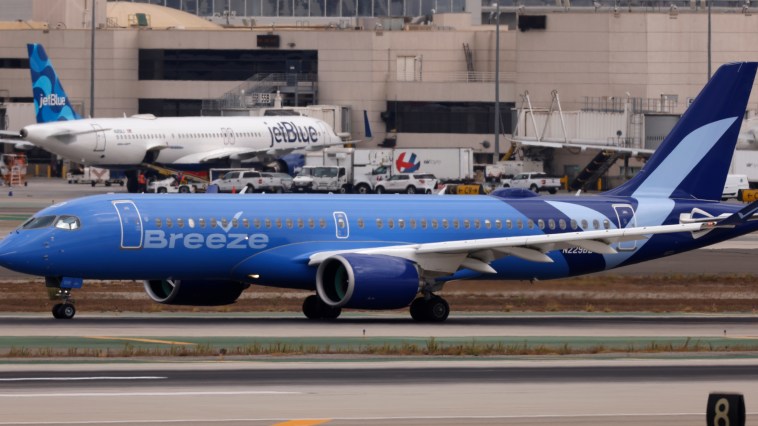 Unruly Breeze Airlines Passenger Picked Up And Put In Seat After Reportedly Spewing Slurs In Viral Video