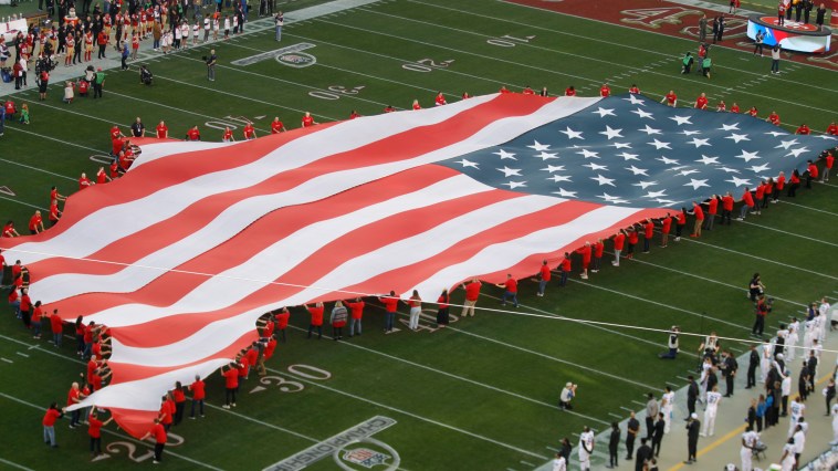 Man Gets Stuck On Giant American Flag During National Anthem Watch Hilarious Video