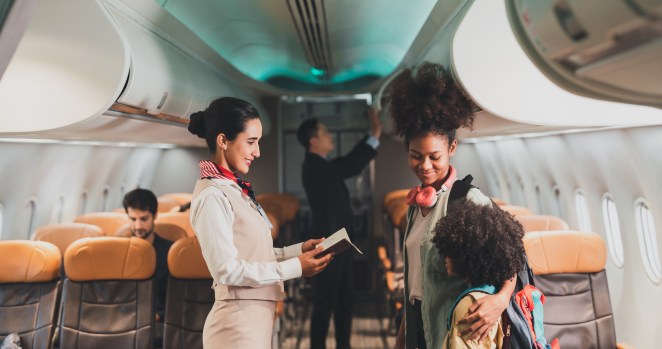 The Real Reasons Flight Attendants Greet You As You Board