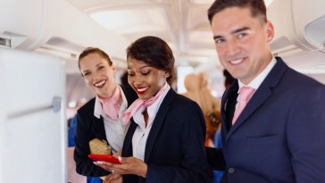 The Real Reasons Flight Attendants Greet You As You Board