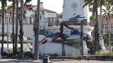 California Bystanders Rush To Save Child Penned Under Helicopter On Huntington Beach