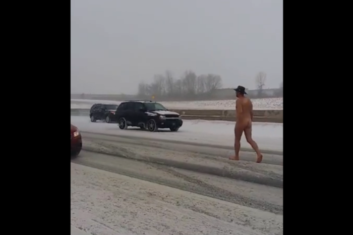 Imagine driving down the road in the middle of a snowstorm and seeing this naked cowboy
