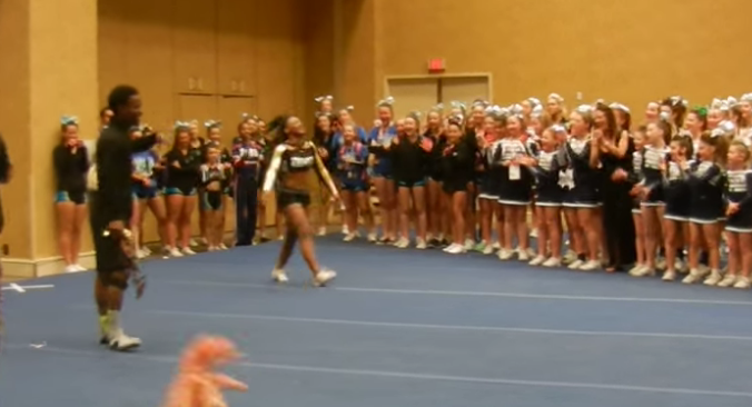 The crowd lost their minds when this cheerleader left her squad in the dust