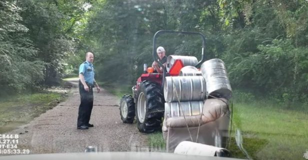 You know you’re a redneck when… you get arrested for pulling a keg couch behind a tractor
