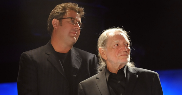 Vince Gill and Willie Nelson salute a dearly departed Country Music Hall of Fame member