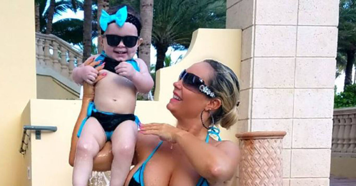 Coco and baby Chanel Nicole soak in some sunshine on vacation with adorable matching bathing suits