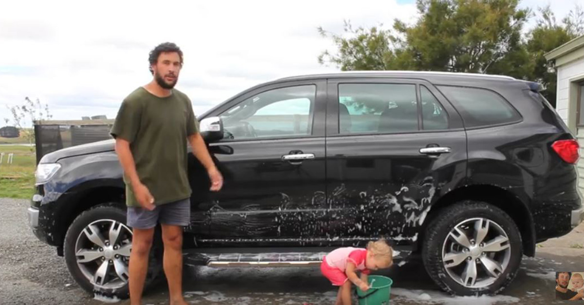 This dad put his baby to good use in an instructional video about how to get a baby to wash a car