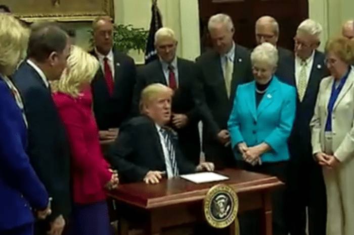 As President Trump signed a bill, he couldn’t resist commenting about the teeny tiny desk