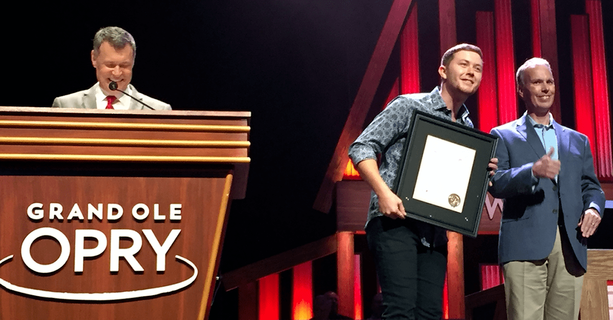 Scotty McCreery gets a big honor from a country icon at the Grand Ole