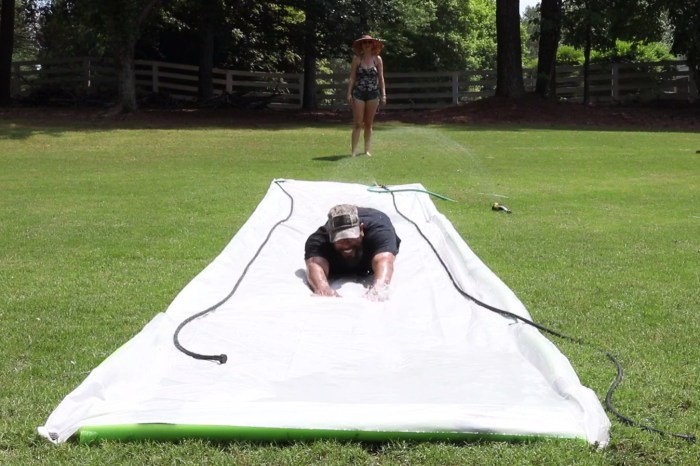 In just a few steps, a huge plastic sheet becomes an irresistibly fun homemade Slip ‘N Slide