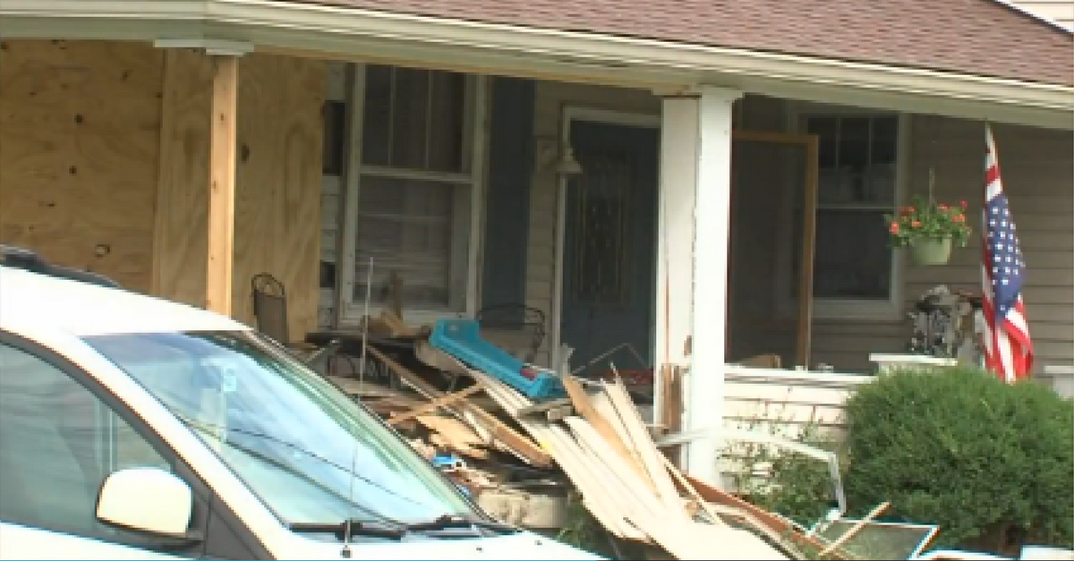 Two sisters were watching TV when a car crashed into their home, taking both their lives