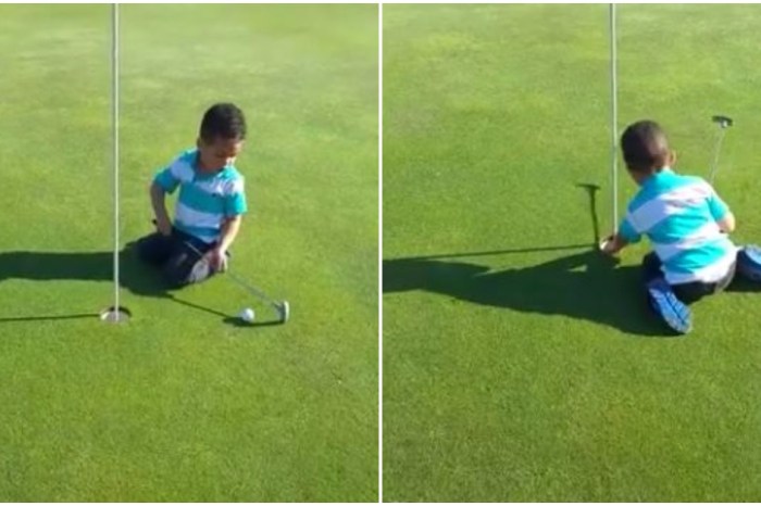 Having difficulty hitting the ball with his mini golf club, this adorable kid makes up his own rule for the sport