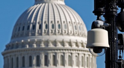 Why did the White House and Congress give spy agencies a “blank check” in the stopgap spending bill?