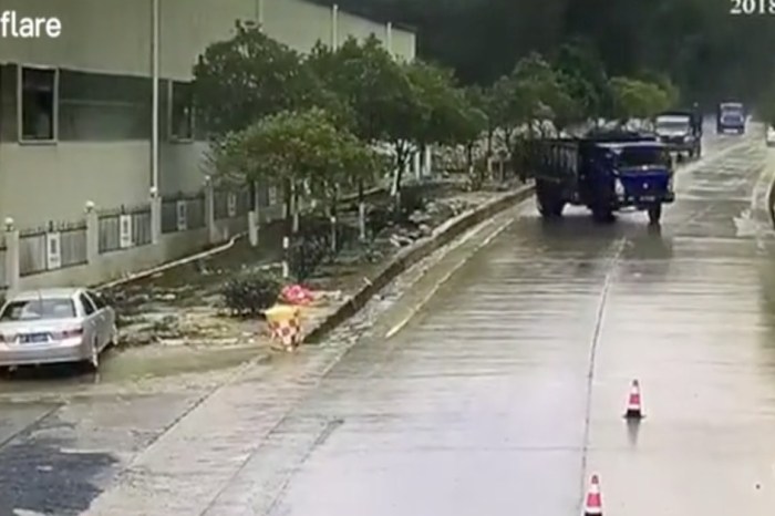 Watch the moment 3 identical trucks slip and slide down a slick road in China
