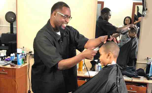 Local barber creates change with charity program