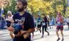 Dad Carries Newborn Son With Down Syndrome Across Marathon Finish Line