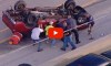 Good Samaritans Help Flip Overturned Truck on Busy Highway to Rescue Driver