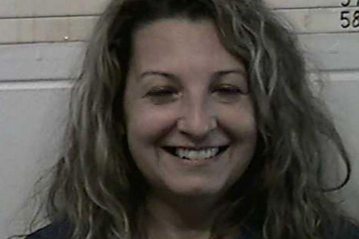 Woman Smiles for Mugshot After Stabbing Husband to Death