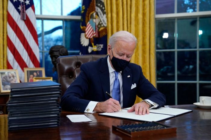 President Joe Biden Signs Executive Actions To Tackle Immigration, COVID, and More